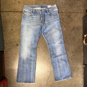 Diesel Industry Denim Division blue jeans with embellished back pockets